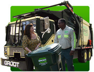 Garbage truck with customer and technician