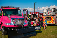 families at national night out fire and police trucks