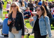 two women with rose wine walking 