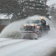 Snow plow with lots of snow