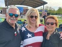 country bash 2022 three people in front of stage