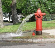 fire hydrant flushing red 