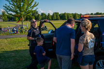 National night out 2021 police officer vehicle with family 