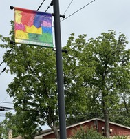 Banner with kids artwork look up oswego may 2024