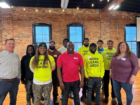 Members of the Equal Opportunity Office and PeoriaCorps pose for a photo with Jacob Jenkins of Serve Illinois.