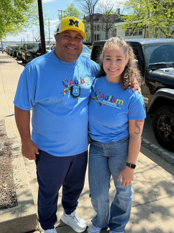 Officer Chris Collins and Officer Ciara Barker of the Peoria Police Department Recruitment Team pose together.