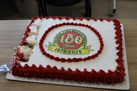 Some takes a slice out of the Peoria Fire Department's 150 Year Anniversary (1875-2025) cake.