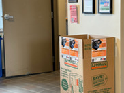 U-Haul cardboard box with flyers attached.