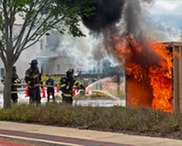 Firefighters put out a controlled burn during a live firefighting demo.