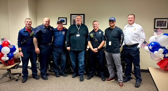Veterans who work for the City pose for a photo before a lunch.