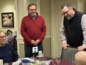 Alderpersons talk with residents in the dining room.