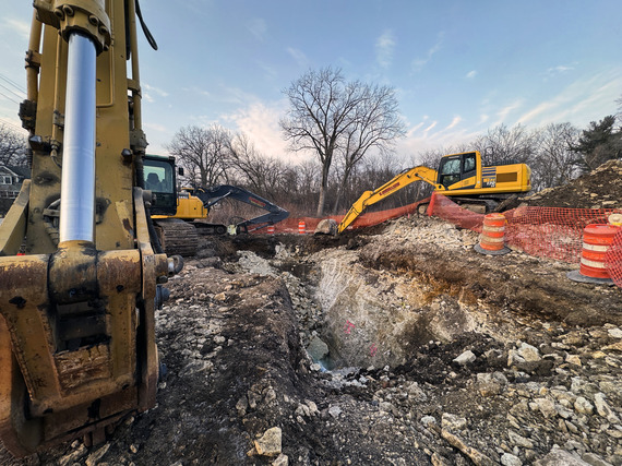 Two excavators doing work on Riverside avenue