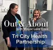 Two women standing in a dental office.