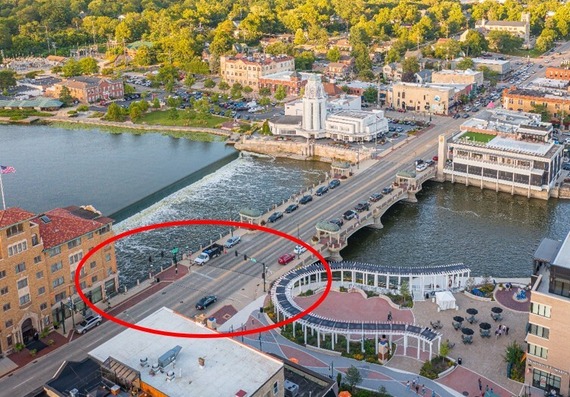 A photo of the Main Street bridge in downtown St. Charles with a red circle around the north entrance of 1st Street Plaza.
