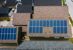 A house with several solar panels installed on the roof.
