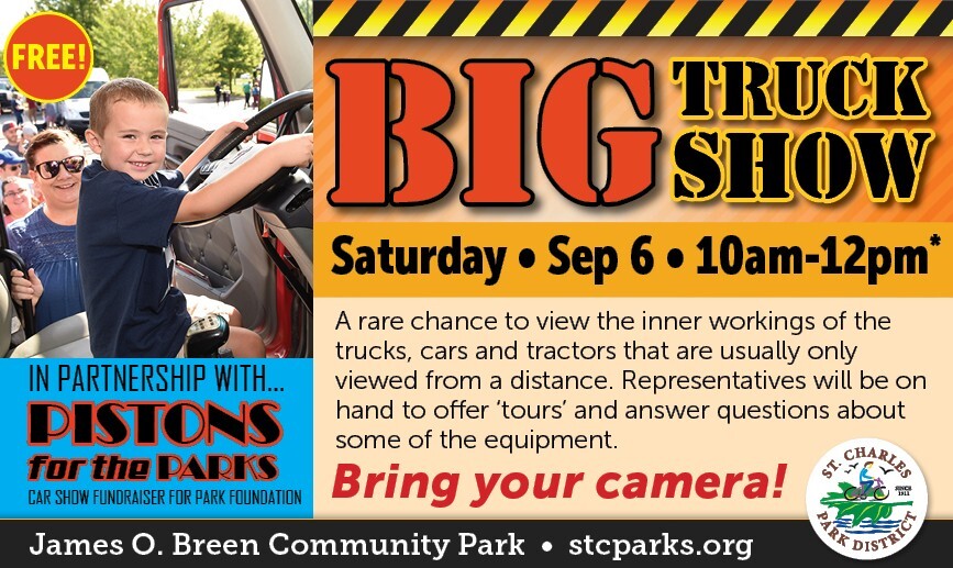 A boy driving a large truck with information about the event.