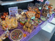 a table full of sweet treats for the bake sale.
