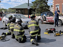 Firefighters put out a controlled fire as part of a demonstration.