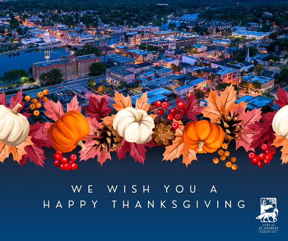 An aerial view of downtown St. Charles just after sunset with the lights shining bright.