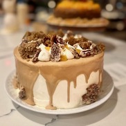 A cake that looks like a marshmallow with a layer of caramel.