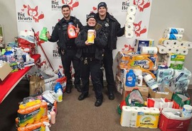 Officers participate in the stuff the squad event.