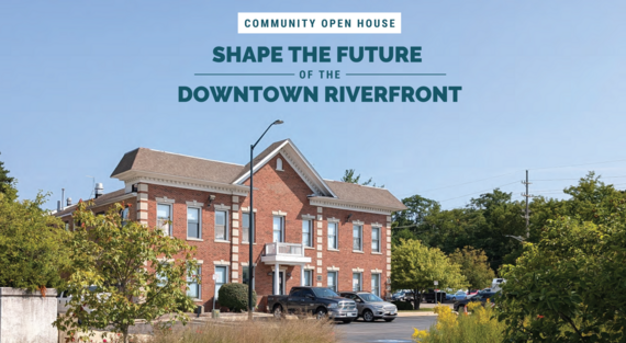 The old police station site with information about the upcoming open house event.