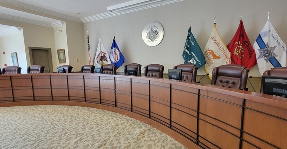 An empty council chambers during the day.