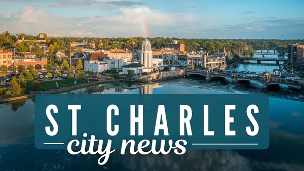 The City Municipal Building overlooks the Fox River with a rainbow centered on the tower. 
