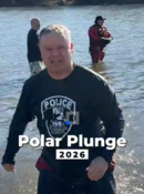 The Mayor exits the cold Fox River during the Polar Plunge.