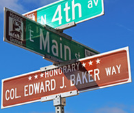 A new honorary street sign goes up at 4th and Main streets as part of a new program.