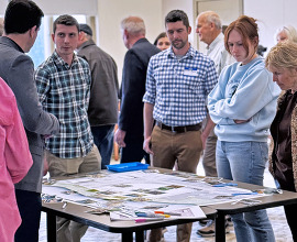 People discuss plans for the new site development.