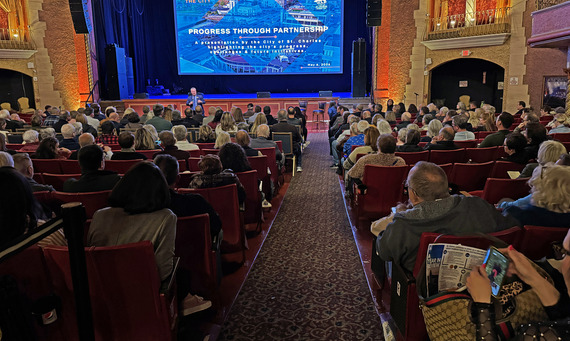 A crowd of people are seated in the historic Arcada Theatre during the 2026 State of the City event.