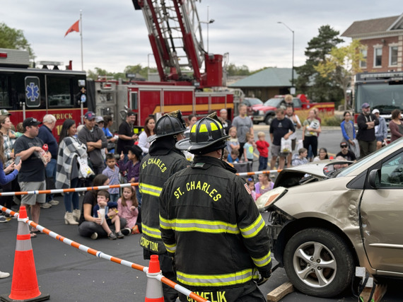 Firefighters perform a vehicle extrication demonstration during the open house event.
