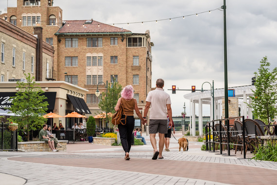 A couple takes a stroll in downtown St. Charles