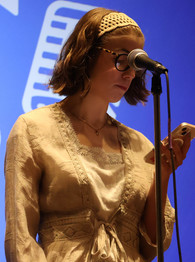 Katelyn Saul performing her poetry piece