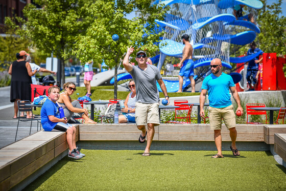 This is a photo of people playing bocce ball on the Monon Expansion.