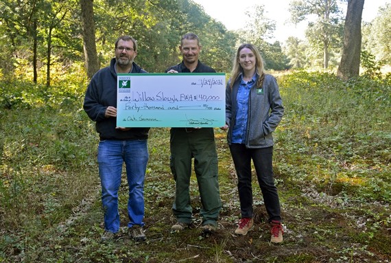 Willow Slough FWA property manager and INRF representatives receiving donation check