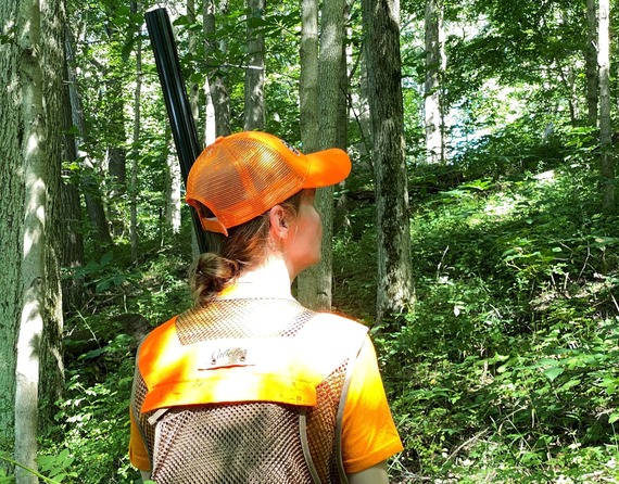 A woman in hunter orange.