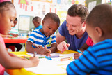 Male child care provider with kids
