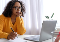 Woman sitting at laptop