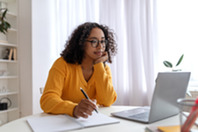 Woman sitting at laptop