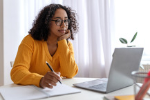 Woman sitting at laptop