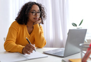Woman sitting at laptop