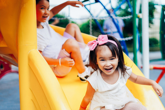 Children Playing on a Slide