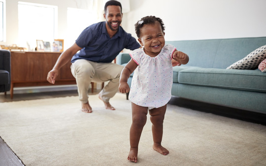 Toddler walking in living room