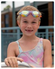 A young girl in her swimsuit at the Municipal Pool