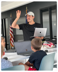 A man teaching a Coding Minds class