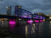 Picture of the Blue Bridge lit up purple for domestic violence