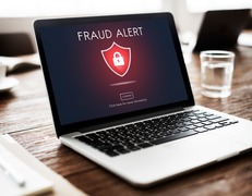 Image of a computer saying fraud alert