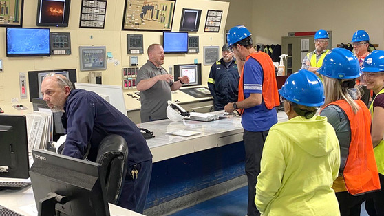 Image of guests and staff in hard hats at the Waste to Energy facility 
